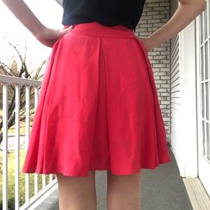 Red pleated skirt knee length
